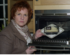 Sharon with a ready meal with a skull and crossbones on it to represent how high in saturated fat the meal is