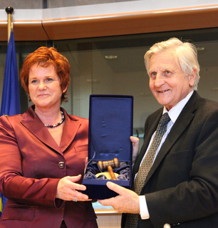 Sharon Bowles MEP presents outgoing ECB President, Jean-Claude Trichet, with gavel (image copyright © ALDE Group European Parliament )